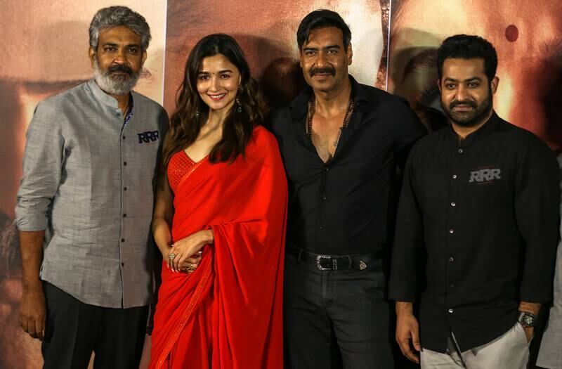 From left, SS Rajamouli with actors Alia Bhatt, Ajay Devgn and NTR Jr at the launch of the trailer of 'RRR' in Mumbai in December 2021. EPA