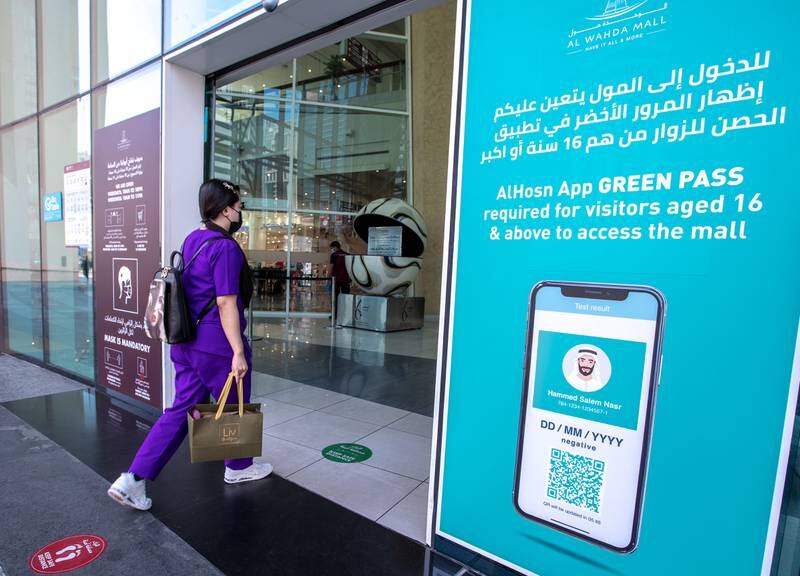 Al Hosn Green Pass awareness signages are put up at the Al Wahda Mall, Abu Dhabi on June 14th, 2021. The new Covid-19 restrictions start tomorrow. Victor Besa / The National.