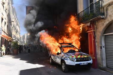 A French Municipal Police car is set on fire on the sidelines of an anti-government demonstration called by the "Yellow Vests" (Gilets Jaunes) movement in Montpellier, southern France.  AFP / Pascal GUYOT