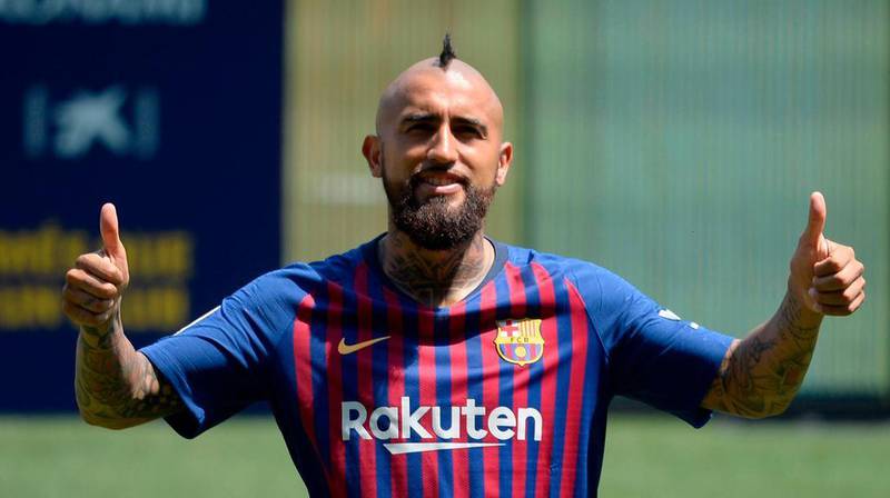 Arturo Vidal poses during his official presentation at the Camp Nou in Barcelona. AFP