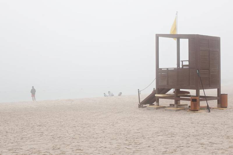 Fog envelops Al Muneera beach on Monday morning. Deepthi Unnikrishnan / The National