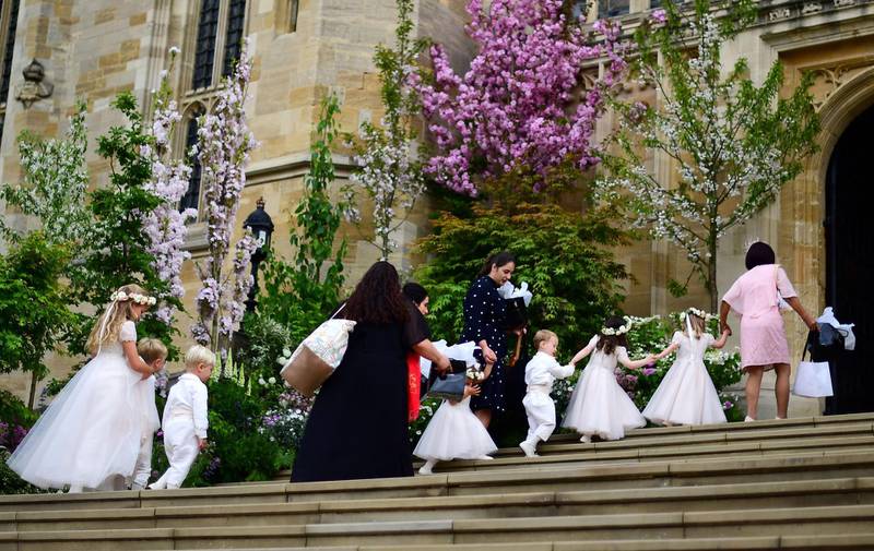 Pageboys and bridesmaids arrive at St George's Chapel for the wedding. AFP