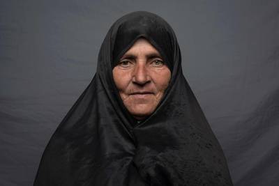 Silk weaver Maryam Osmani, 50, poses for a portrait in Herat.