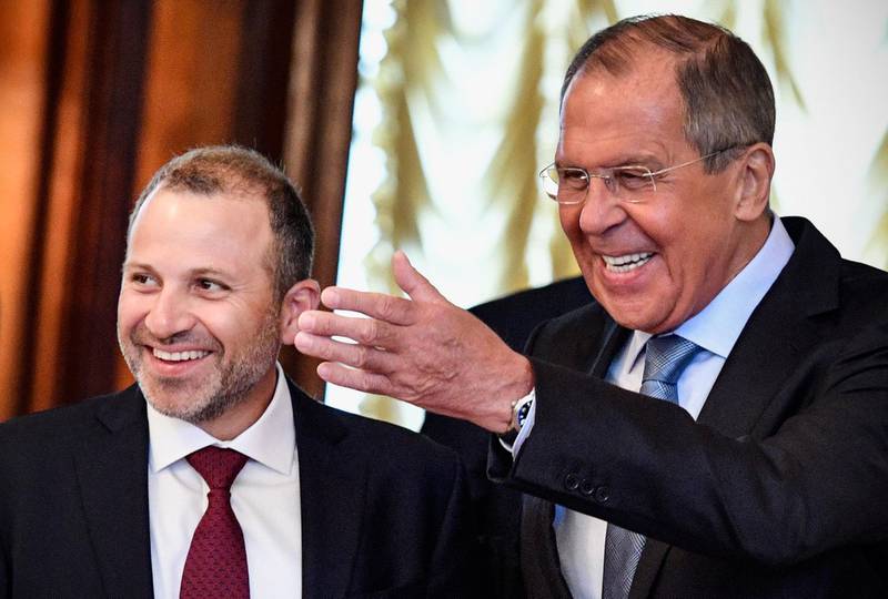 Russian Foreign Minister Sergei Lavrov (R) welcomes his Lebanese counterpart Gebran Bassil (L) during their meeting, in Moscow, on August 20, 2018 (Photo by Alexander NEMENOV / AFP)