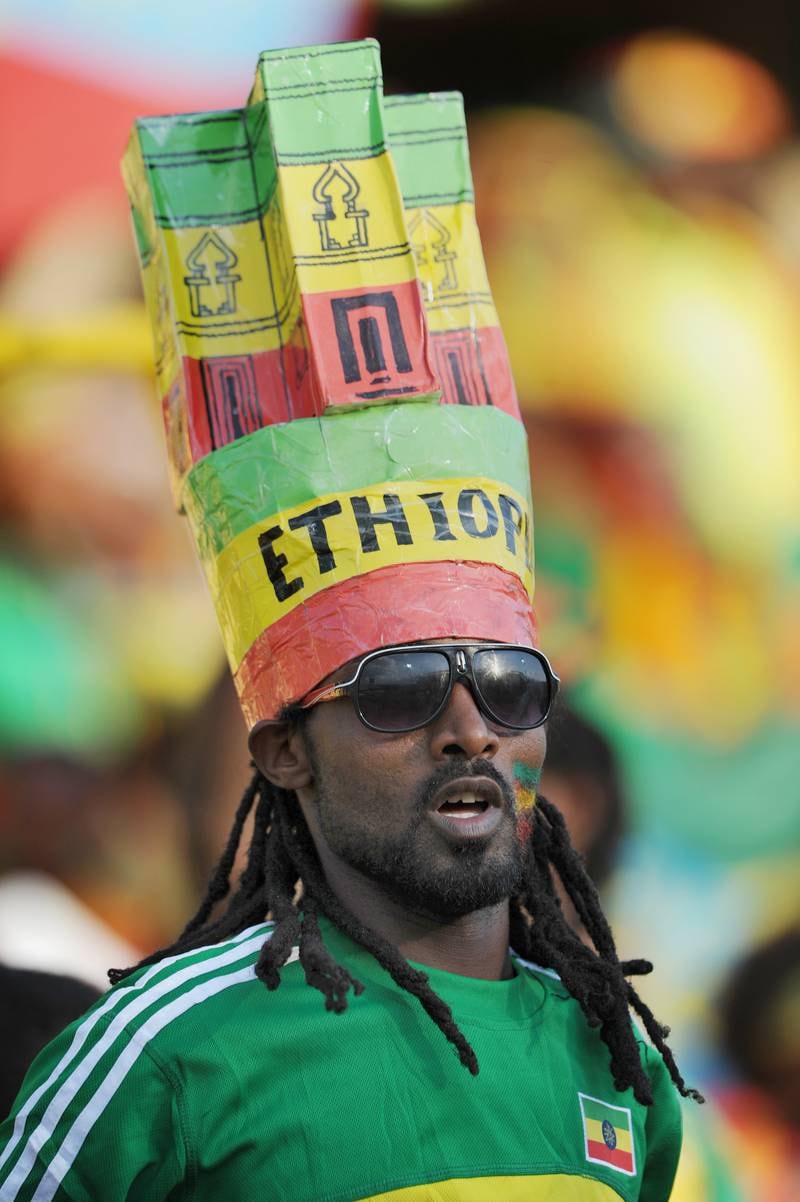 An Ethiopia fan in a distinctive hat watches his team’s 2013 African Cup of Nations Group C match against Nigeria, in Rustenburg, South Africa.