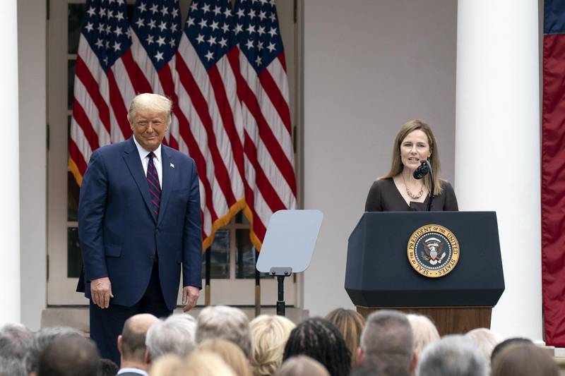 Amy Coney Barrett, US President Donald Trump's nominee for associate justice of the Supreme Court, speaks as President Donald Trump listens during an announcement ceremony in the Rose Garden of the White. Bloomberg