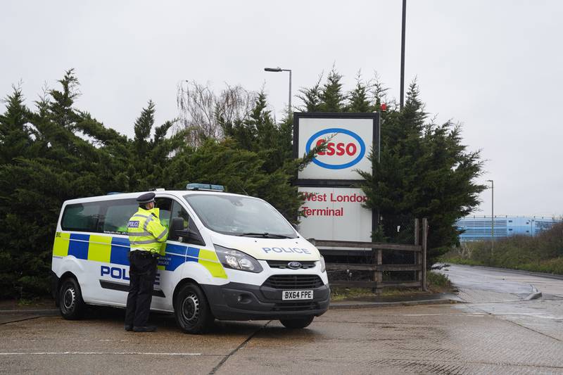 A police van at the Esso plant as protests by activists at various refineries in the UK enter a fourth day.  PA