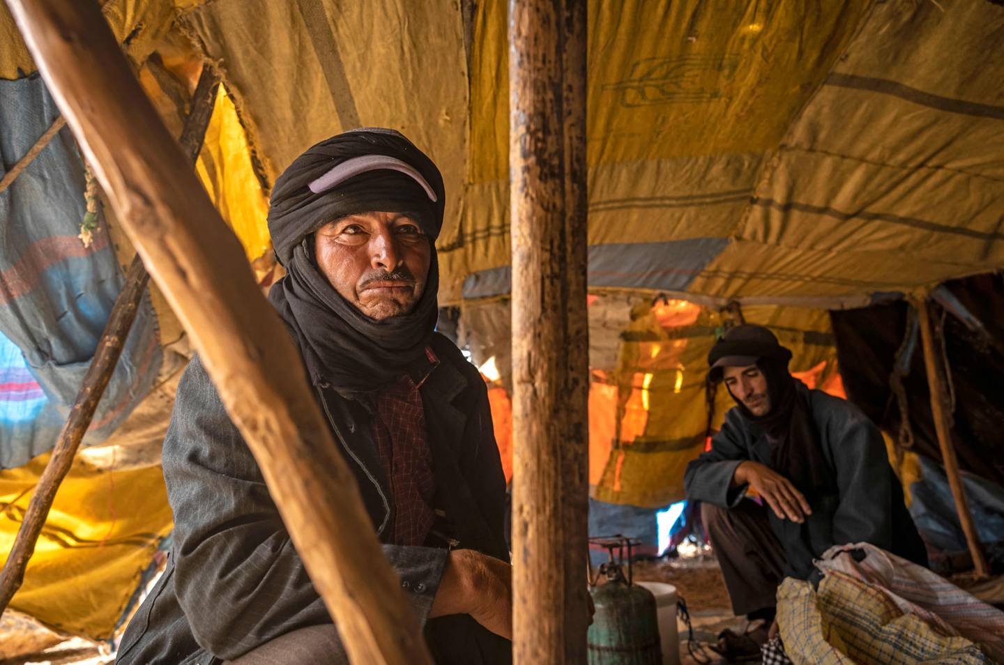 Moha Ouchaali sits in his tent near the village of Amellagou where Morocco's last nomads live. They say their ancient lifestyle has become impossible to sustain as climate change brings ever more intense droughts.  AFP