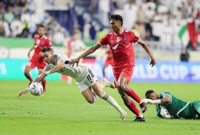 UAE's Caio Canedo and Chhiring Tamang Lama of Nepal battle for the ball.