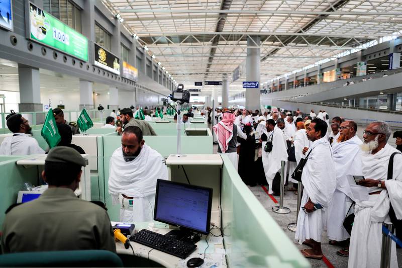 Muslim worshippers queue for immigration and passport control at the Hajj terminal of the King Abdulaziz international airport in Jeddah. Mast Irham / EPA