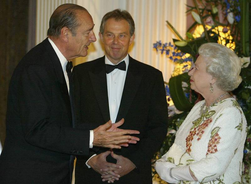 Queen Elizabeth chats to former French president Jacques Chirac at Gleneagles, Scotland, in July 2005. Getty Images          