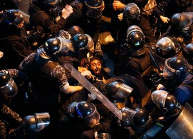Lebanese riot police arrest anti-government protester Chebl Yassine during a demonstration outside a police station in Beirut on January 15, 2020. AP Photo