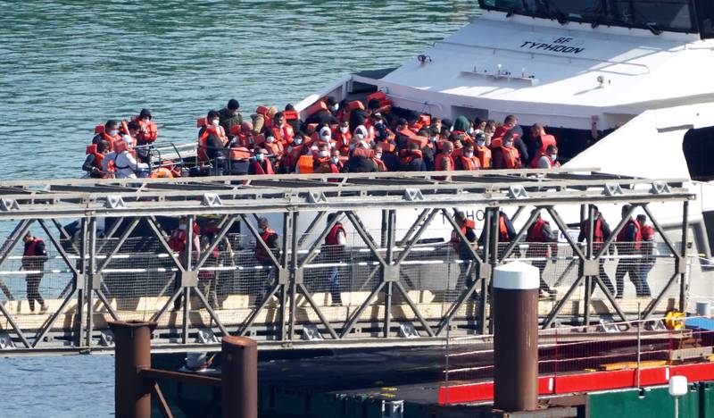 A group of people thought to be migrants are brought in to Dover, Kent, from a Border Force vessel following a small boat incident in the Channel. Photo: PA