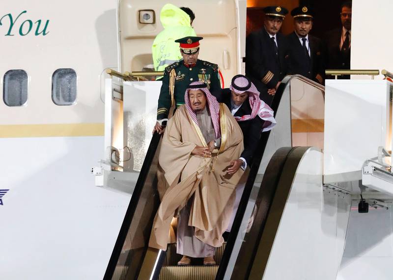 Saudi Arabia's King Salman (bottom) disembarks from a plane upon his arrival at Vnukovo airport outside Moscow, Russia October 4, 2017. REUTERS/Sergei Karpukhin