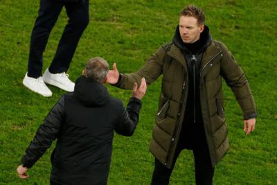 Solskjaer (L) congratulates Leipzig coach Julian Nagelsmann after the final whistle. AFP