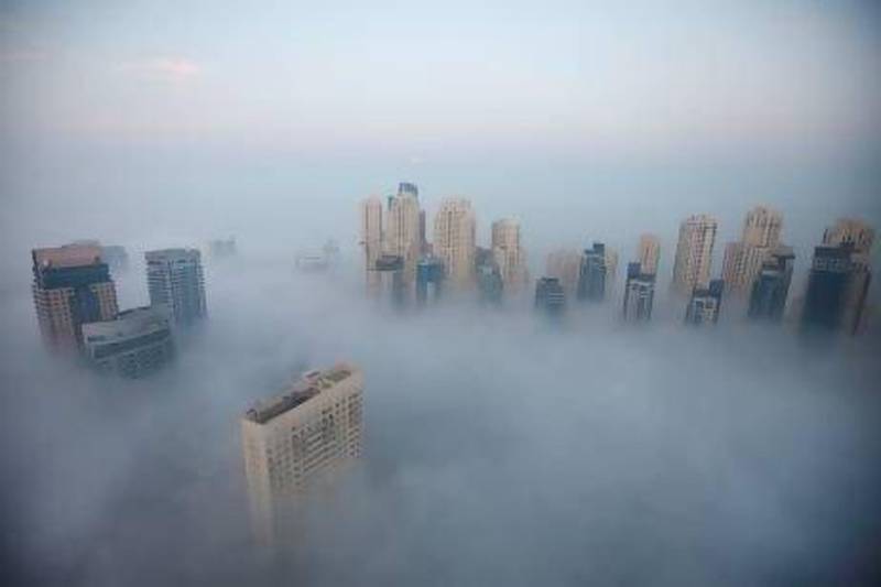 Morning fog descends over Dubai Marina in Dubai. The UAE has seen blankets of severe fog in January. Sarah Dea / The National