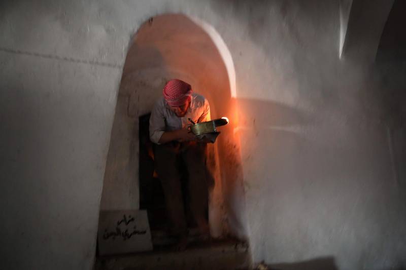 An Iraqi Yezidi visits the Temple of Lalish, in a valley near the Kurdish city of Dohuk about 430km northwest of the capital Baghdad, on July 16, 2019. AFP