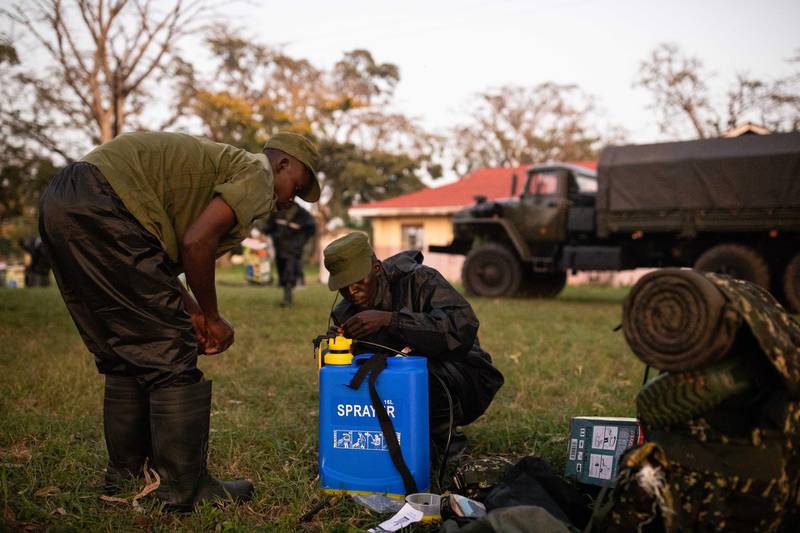 Soldiers prepare to spray crops with pesticide to counter the locust invasion in Katakwi, Uganda. Getty Images