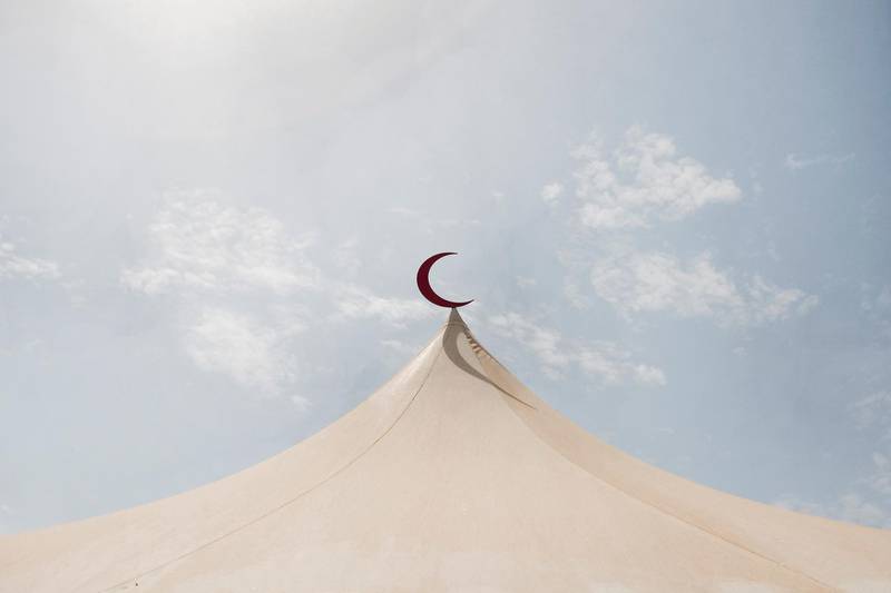 July 26, 2011, Abu Dhabi, UAE:

An important part of Ramadan is giving. In order to facilitate this act a bit more easily the Red Crescent is setting up tents all across the city, this one is located next to Marina Mall. 

Lee Hoagland/The National