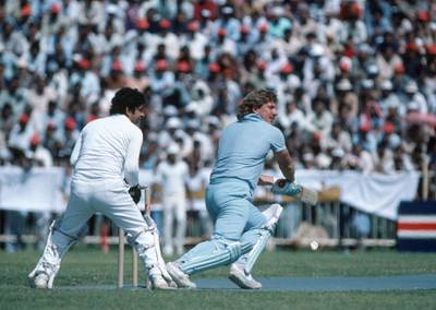 Ian Botham batting for an England XI during a match against a Pakistan XI at the Sharjah Cricket Association Stadium, Sharjah, 4th March 1983. The wicketkeeper for Pakistan is Wasim Bari. (Photo by Patrick Eagar/Popperfoto/Getty Images)