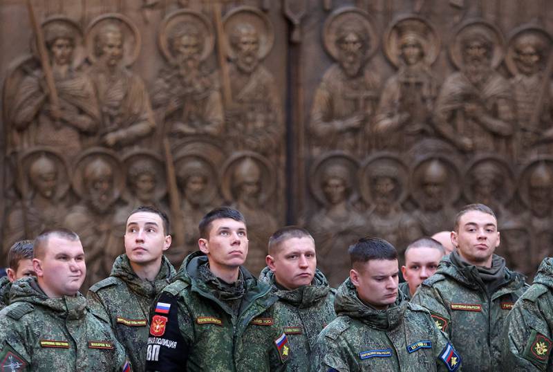 Russian soldiers attend a service during the military campaign in Ukraine. Reuters