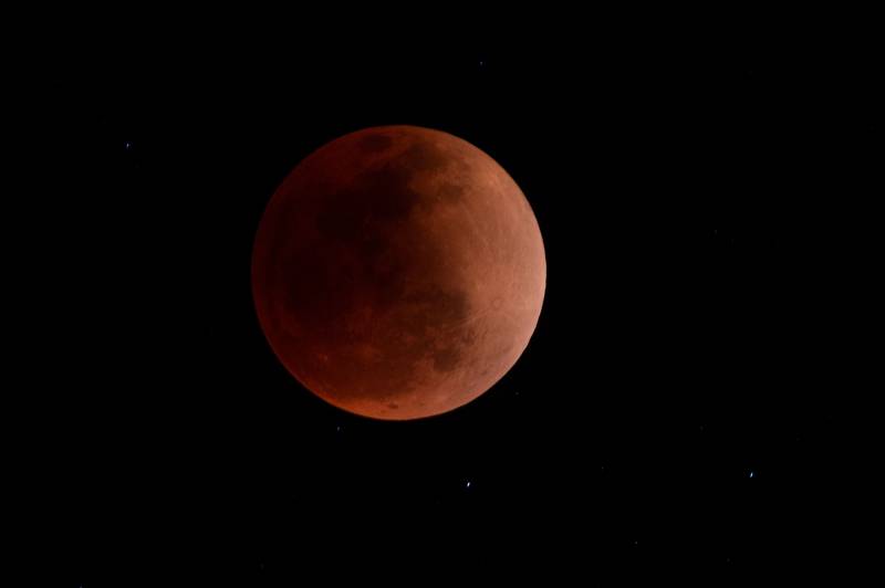 The blood moon, similar to this one whose pictures were taken in Peru during a total lunar eclipse in May, will be visible in certain parts of the world on November 8. AFP