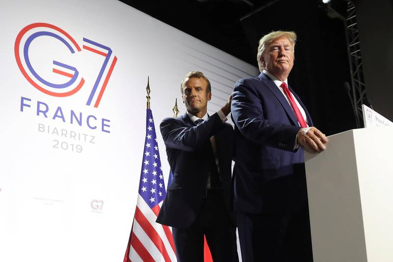 FILE - In this Aug. 26, 2019 file photo, President Donald Trump and French President Emmanuel Macron wrap up a joint press conference at the G-7 summit in Biarritz, France. With entire countries on lockdown, state visits canceled and key meetings postponed or moved online, the coronavirus pandemic may have significant implications for weighty matters of war and peace, arms control and human rights. (AP Photo/Andrew Harnik)
