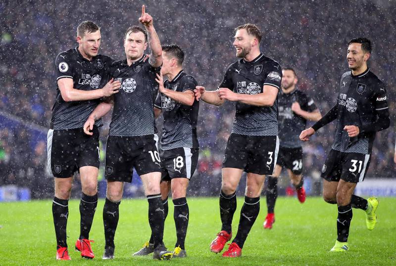 Burnley's Ashley Barnes (second left) celebrates scoring his side's third goal of the game from the penalty spot with team mates during the Premier League match at the AMEX Stadium, Brighton. (Photo by Adam Davy/PA Images via Getty Images)