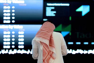 An investor monitors the stock exchange at the Saudi stock exchange. Fayez Nureldine / AFP
