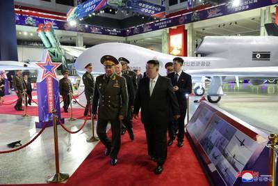 North Korean leader Kim Jong-un and Russia's Defence Minister Sergei Shoigu visit an arms exhibition on the 70th anniversary of the Korean War armistice. Reuters