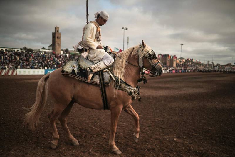 A horse rider prepares to exit after his troupe took part in Tabourida, a traditional horse riding show also known as Fantasia, in the coastal town of El Jadida, Morocco,