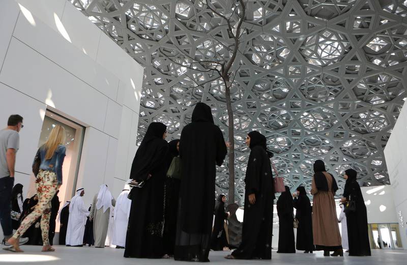 Emirati officials and others visit the Louvre Museum in Abu Dhabi, United Arab Emirates, Tuesday, Dec. 19, 2017. The newly-opened Louvre Abu Dhabi is unveiling a new exhibition of around 150 pieces of artwork featuring collections from the Louvre in Paris and the Palace of Versailles. (AP Photo/Kamran Jebreili)
