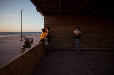 Ahmaida Manssour, 31, a surf coach, and his friends, at Nuevas Olas surf club, before iftar in Tarfaya, Morocco. Reuters