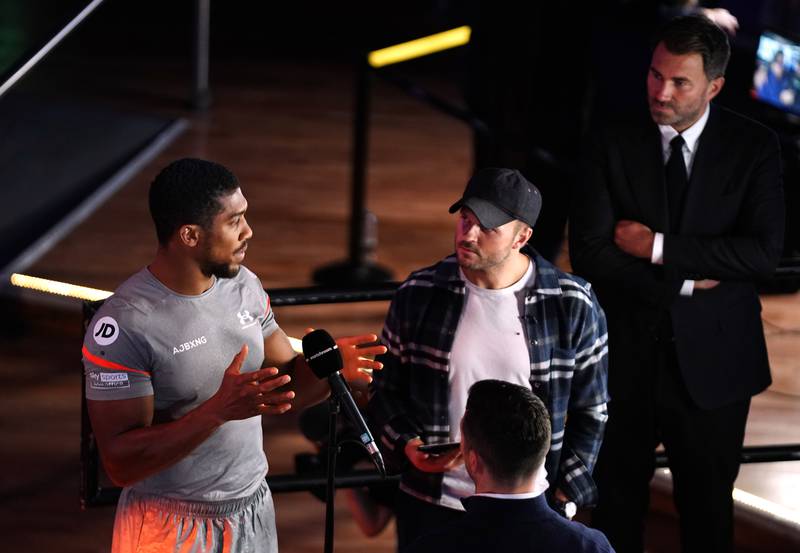 Anthony Joshua and promoter Eddie Hearn, right. Getty