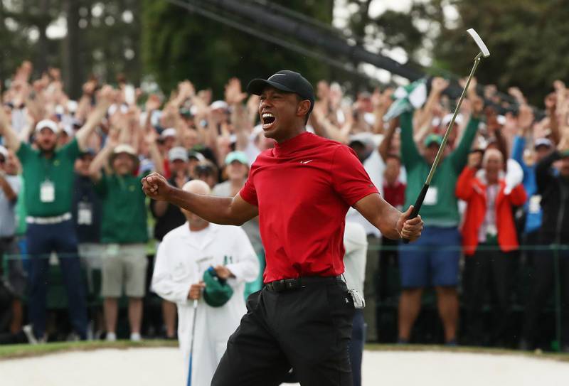 Tiger Woods celebrates on the 18th hole to win his first major title in more than a decade after battling injuries and personal issues. Jonathan Ernst / Reuters
