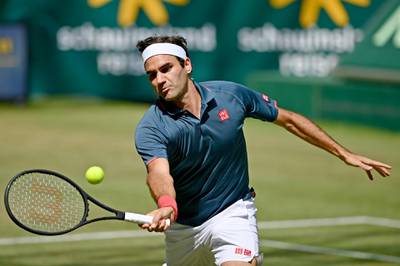 HALLE, GERMANY - JUNE 16: Roger Federer of Switzerland plays a forehand in his match against Felix Auger-Aliassime of Canada during day 5 of the Noventi Open at OWL-Arena on June 16, 2021 in Halle, Germany. (Photo by Thomas F. Starke/Getty Images)