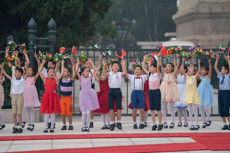 Children welcome Sheikh Mohamed bin Zayed to the Sheikh Mohamed bin Zayed, Crown Prince of Abu Dhabi and Deputy Supreme Commander of the UAE Armed Forces, is welcomed to the Great Hall of the People in Beijing, where he met with President Xi Jinping on Monday. Courtesy Sheikh Mohamed bin Zayed Twitter