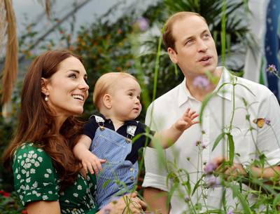 LONDON, ENGLAND - JULY 02:   (EDITORIAL USE ONLY) Catherine, Duchess of Cambridge holds Prince George as he and Prince William, Duke of Cambridge's look on while visiting the Sensational Butterflies exhibition at the Natural History Museum on July 2, 2014 in London, England. The family released the photo ahead of the first birthday of Prince George on July 22.  (Photo by John Stillwell - WPA Pool/Getty Images)
