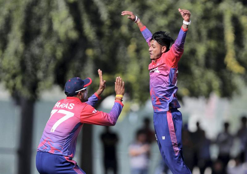 Dubai, United Arab Emirates - January 26, 2019: Sandeep Lamichhane of Nepal takes the wicket of Muhammad Usman of the UAE in the the match between the UAE and Nepal in a one day internationl. Saturday, January 26th, 2019 at ICC, Dubai. Chris Whiteoak/The National