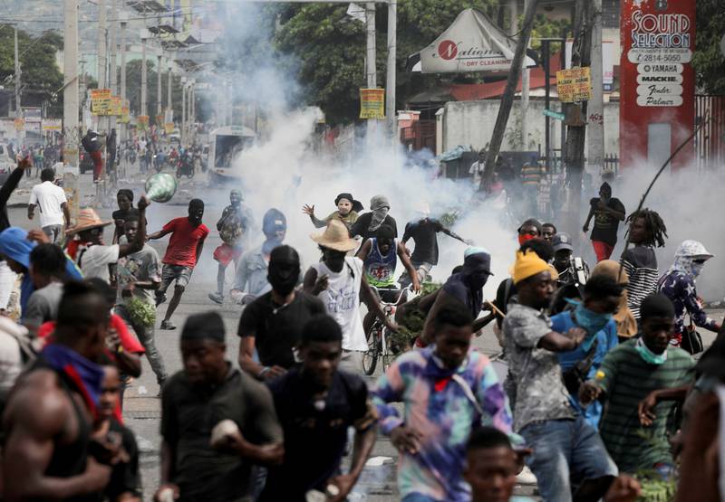 Police fire tear gas during a protest demanding the resignation of Haiti's Prime Minister Ariel Henry after weeks of shortages, in Port-au-Prince. TPX