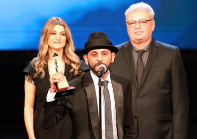 Iraqi director Mohanad Hayal receives Best Arab Director for 'Haifa Street' during the closing ceremony of the 41st Cairo International Film Festival. EPA
