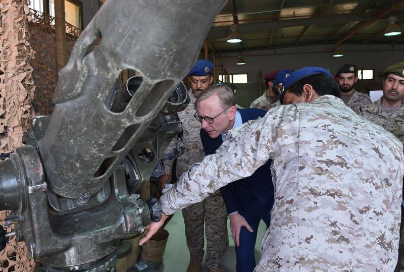 Brian Hook (C), the US special representative on Iran, listens to a Saudi official as they check what Saudi officials said was an Iranian-made launcher used by the Huthi rebels in Yemen, during a visit to an army base in al-Kharj, south of the Saudi capital Riyadh, on June 21, 2019. The US said Iran has no right to respond to diplomacy "with military force", a day after Washington said Tehran shot down a US drone over the Strait of Hormuz. "Our diplomacy does not give Iran the right to respond with military force," Hook, told reporters in Saudi Arabia.
 / AFP / Fayez WEHBE
