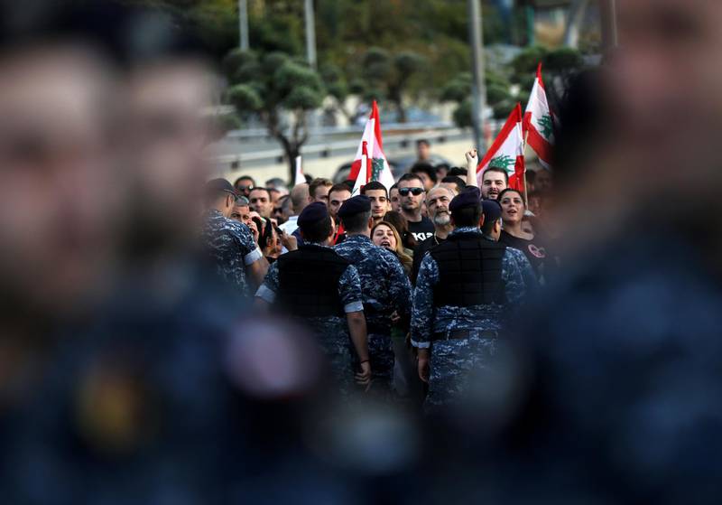 Members of the security forces gather as backers  of the Free Patriotic Movement founded by the Lebanese president stage a rally in his support on a road leading to the presidential palace in Baabda near the capital Beirut. AFP