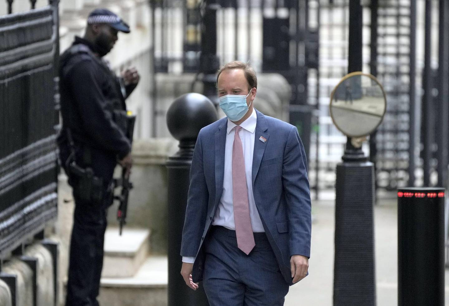 Britain's Health Secretary Matt Hancock arrives at Downing Street in London, Wednesday, May 26, 2021. U.K. Prime Minister Boris Johnson's former chief aide lashed out at the government he once served, saying people died "in horrific circumstances" because of authorities' failed response to the coronavirus pandemic. Cummings made a blistering attack Wednesday, May 26, 2021 on the government he once worked for, saying some ministers and officials went on vacation as the pandemic swept towards the U.K. in February 2020. He told lawmakers investigating Britain's coronavirus response that the government "was not operating on a war footing" and "lots of people were literally skiing." (AP Photo/Frank Augstein)