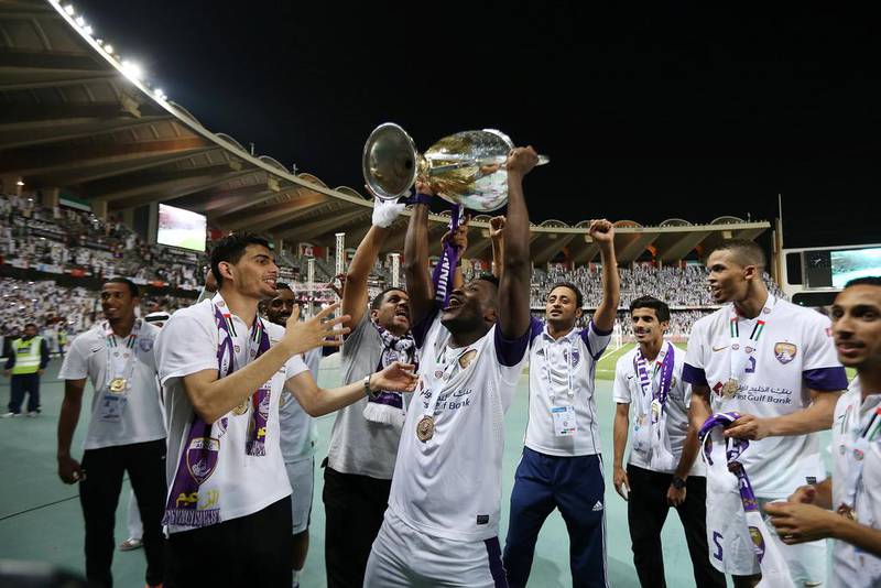 Al Ain players celebrate winning the President's Cup final on Sunday at Zayed Sports City Stadium in Abu Dhabi. Pawan Singh / The National / May 18, 2014