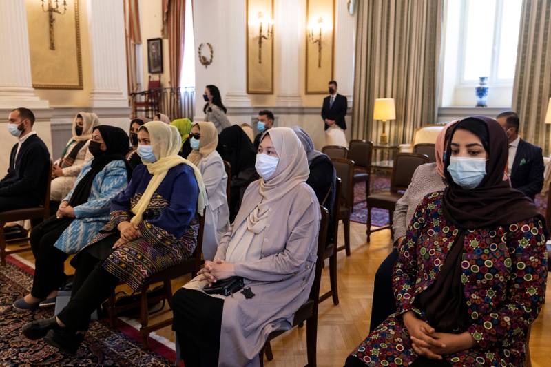Afghan lawyers and judges attend a welcome ceremony in Athens, Greece, in October 2021 after fleeing the Taliban takeover. Another group has taken refuge in neighbouring Albania. Reuters