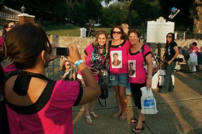 Fans of Elvis Presley gather outside Graceland, which remains a popular tourist destination more than 35 years after his death. Robert Macpherson / AFP