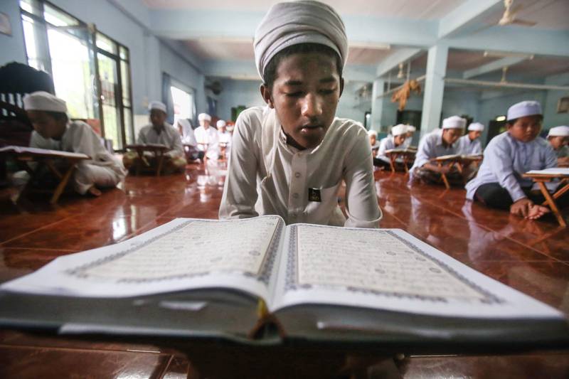 Orphans read copies of the Quran at the Majamma Nuruljinan in Pattani, southern Thailand. AFP