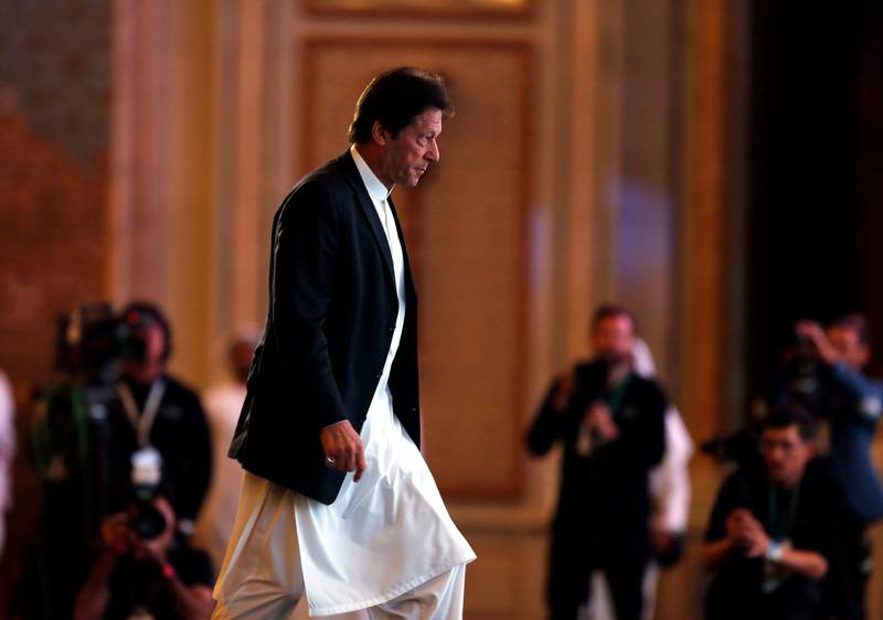 Pakistani Prime Minister Imran Khan prepares to speak at the opening of the Future Investment Initiative conference, in Riyadh, Saudi Arabia, Tuesday, Oct. 23, 2018. The high-profile economic forum in Saudi Arabia is the kingdom's first major event on the world stage since the killing of writer Jamal Khashoggi at the Saudi Consulate in Istanbul earlier this month. (AP Photo/Amr Nabil)
