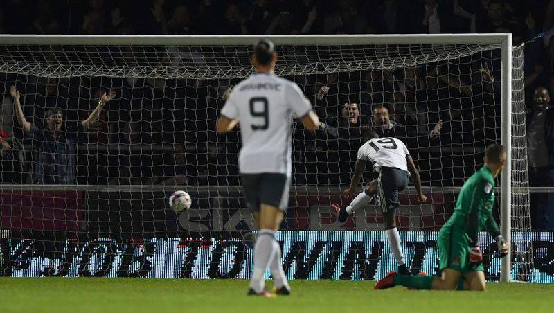 Manchester United striker Marcus Rashford, second right, scores his team’s third goal. Ben Stansall / AFP